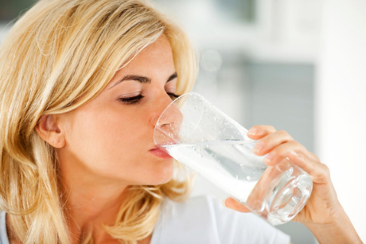 The Hydration Misconception, image of woman drinking water