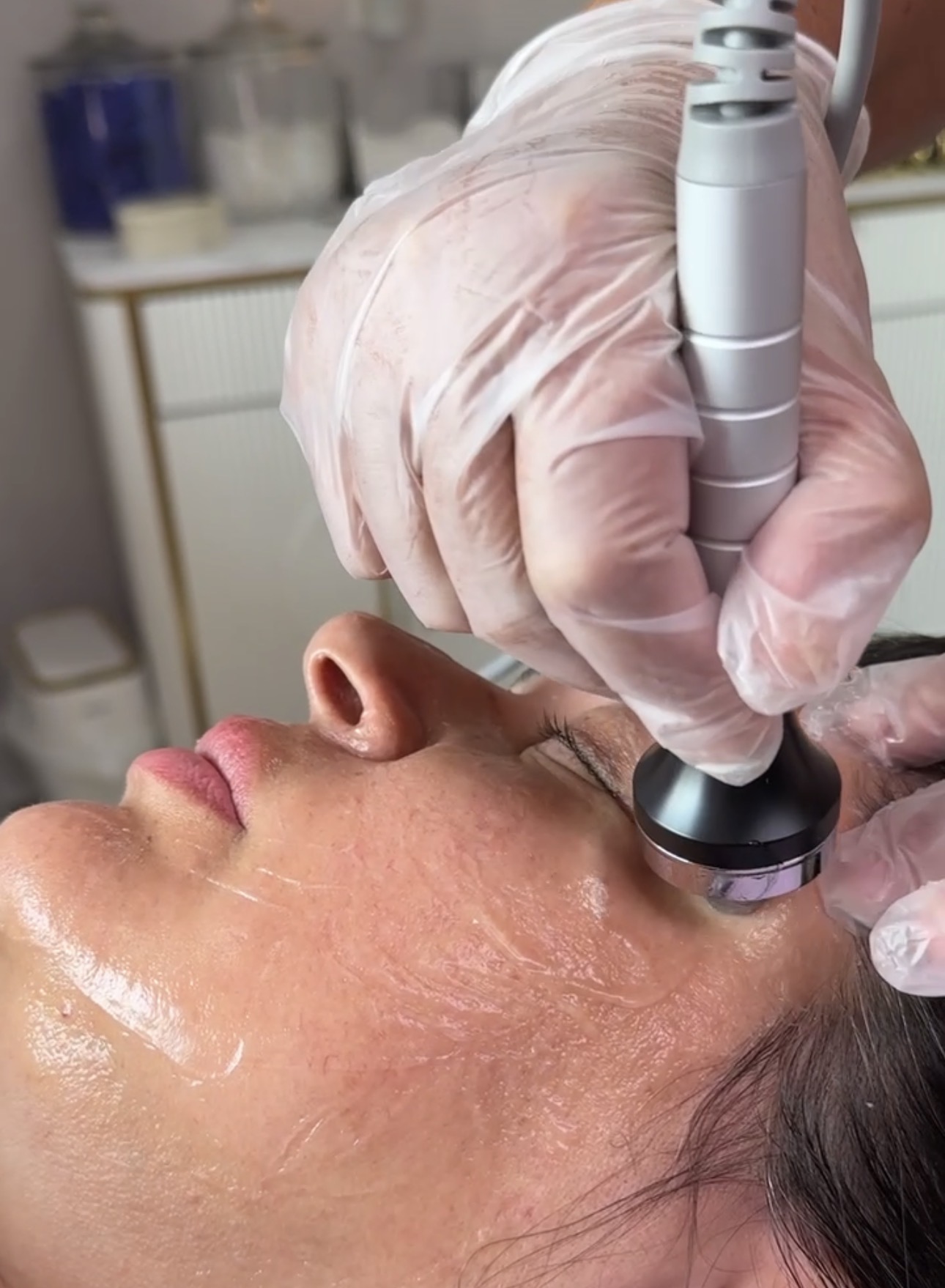 Ultrasound facial device being used during treatment